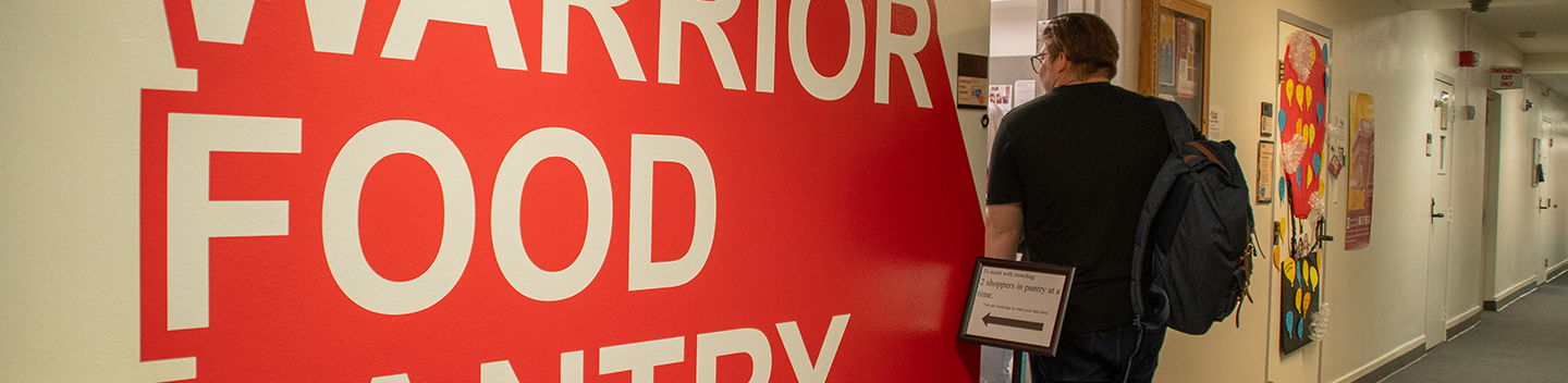  A student stands outside of the Warrior Food Pantry at the Stockton Campus.