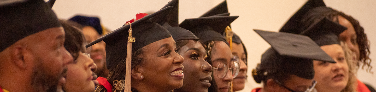 Black students celebrating their graduation.