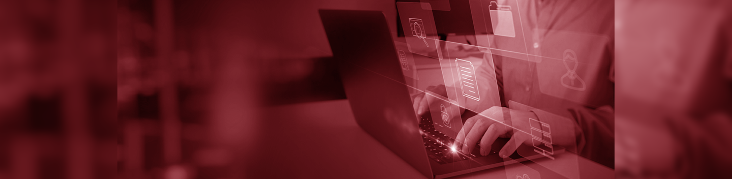 man typing on keyboard, red tint
