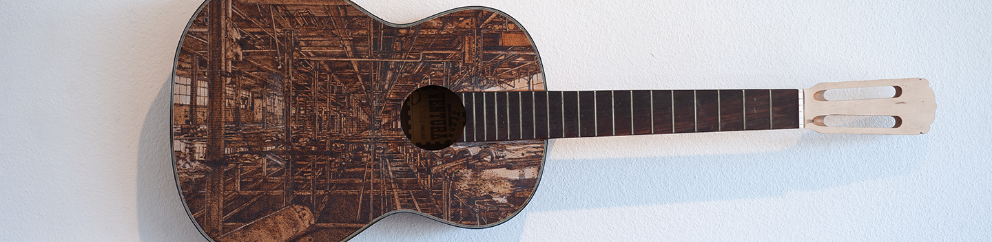 An art piece of an acoustic guitar.