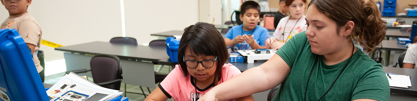 Students work on a project inside a classroom.