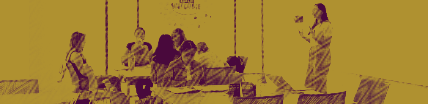 Students seated inside a classroom during a lecture.