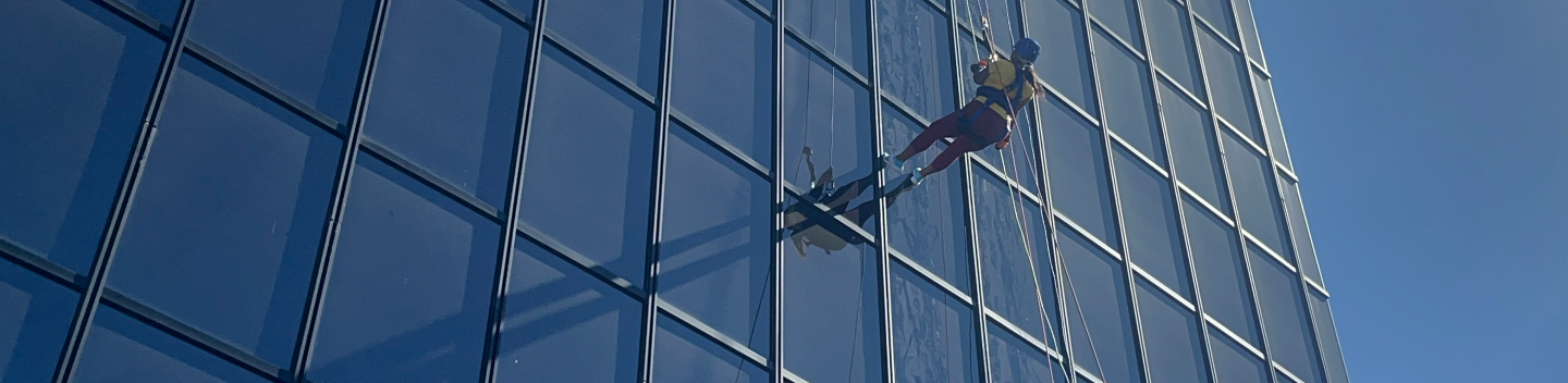 Faculty Member Donnieau Snyder rappels at Over the Edge