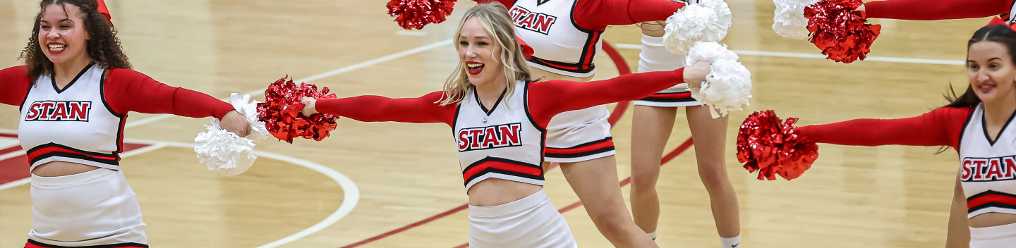Stan State cheerleaders performing at half time during homecoming in the Fitzpatrick Arena