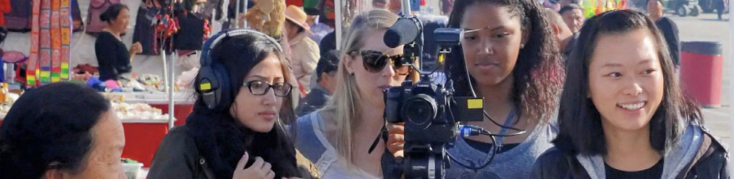 Visual anthropology students conducting researching and filming a documentary.