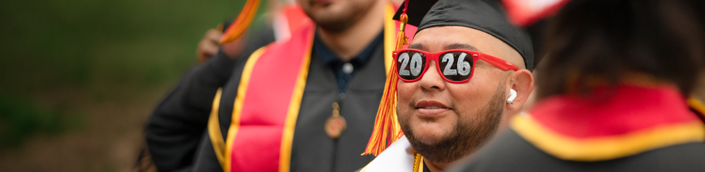 Graduate wearing 2026 sunglasses