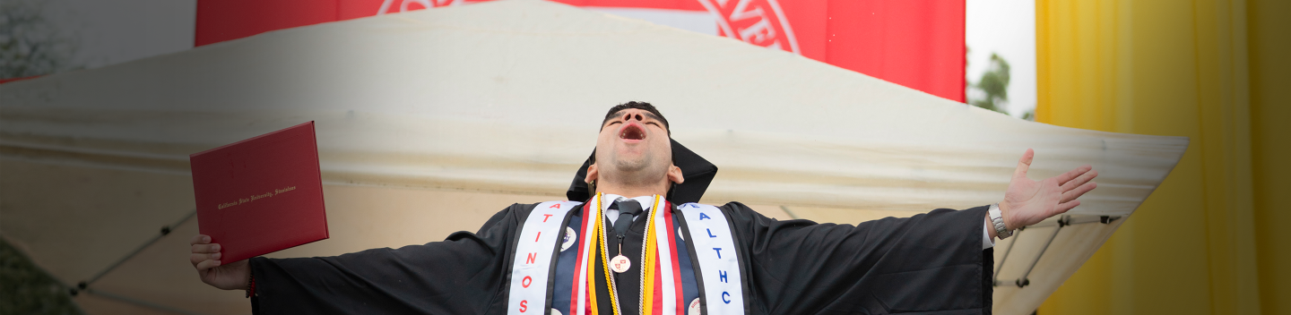Graduate celebrating in the rain