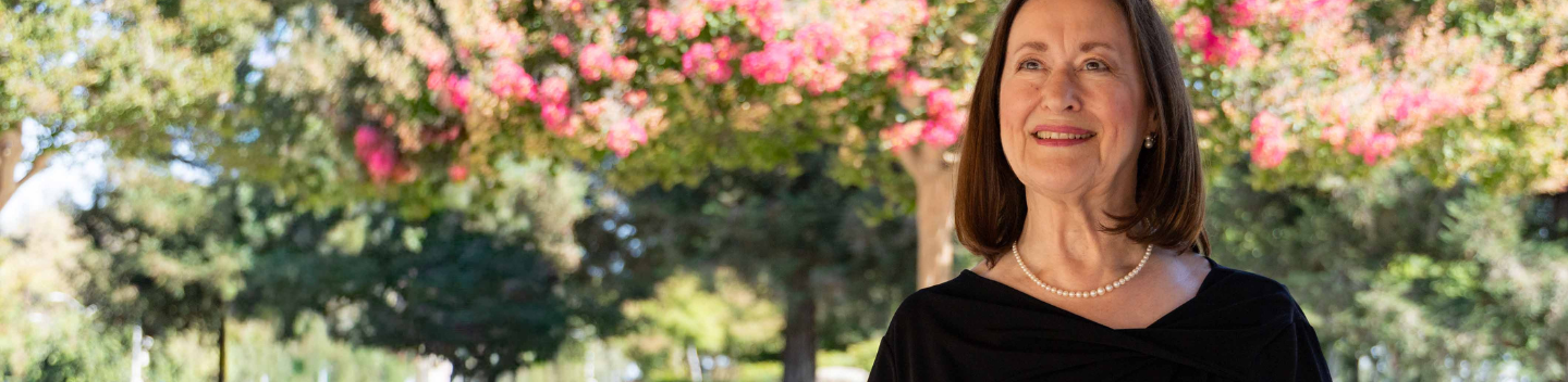 Deborah Kavasch smiling outside.