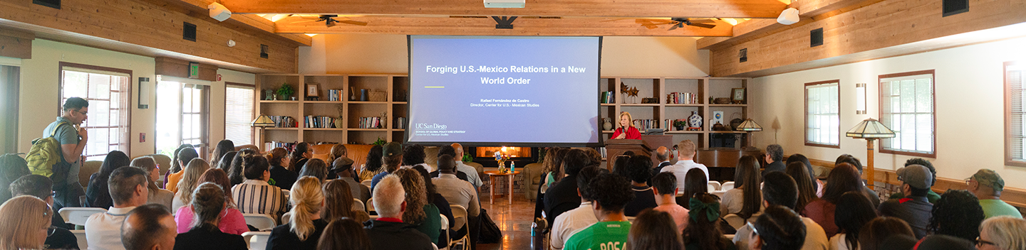 President Britt Rios-Ellis speaks to a seated audience in the John Stuart Rogers Faculty Development Center during the Presidential Distinguished Speaker Series featuring Rafael Fernández de Castro.