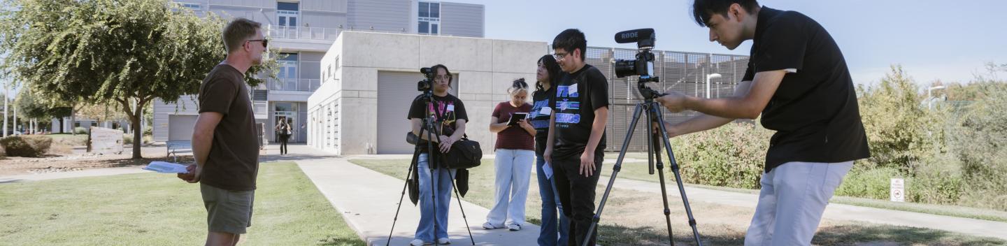 Students conduct an on-camera interview.