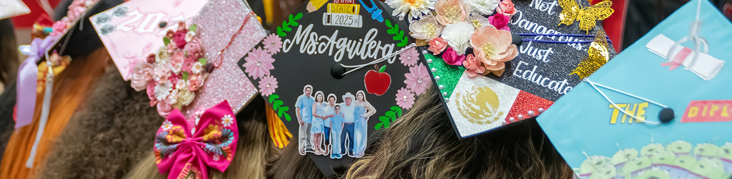Graduates wear decorated caps featuring flowers, family photos, cultural symbols and messages during Stanislaus State’s Chicanx/Latine Graduation Celebration.