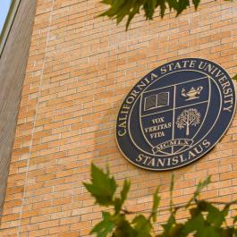 University shield on building