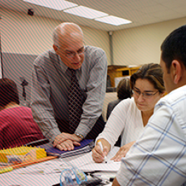 Professor speaking to students.