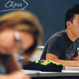 Student taking notes in class