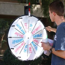 Stan State student spinning wheel of prizes