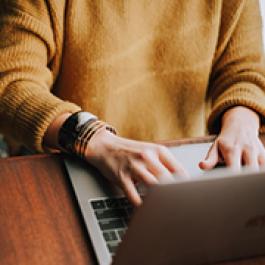 Person typing on computer