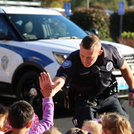 Police officer high fiving child