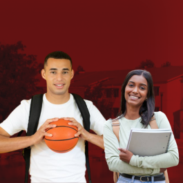 Two student posed in front of the Housing and Residential Life area.