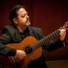 Jeremy Garcia playing the guitar.