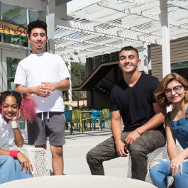 Four students in a group photo