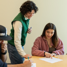 A tutor at the Learning Commons assists a student