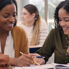 Women tutoring student