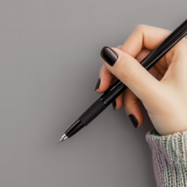 Hand holding a pen