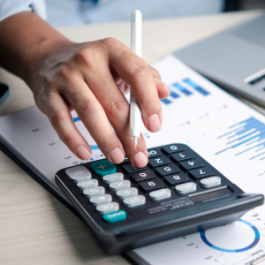 Man calculates expenses on a calculator