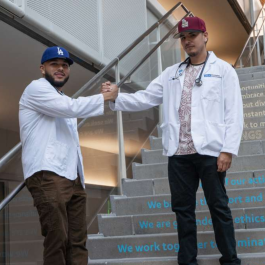 Alexis Aleman and Irvin Garcia posed on a stairway.