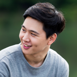 A young man looking over to his side.