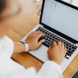 a woman is seen completing a form online