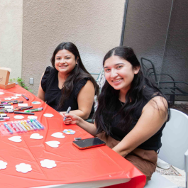 Two students participating in an art activity hosted by CAPS