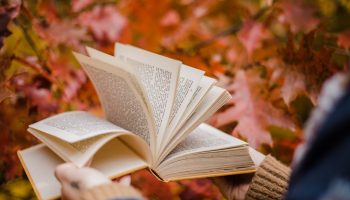 book with fall backdrop