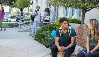 Students at Stockton Campus talking.