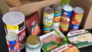 image of food items in a cardboard box and displayed on a table