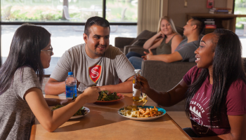 students eating in village cafe