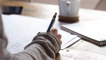 Student taking notes.