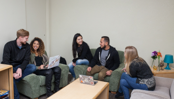 A group of students inside a dorm at Stan State.