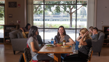 A group of students dining at the Village Cafe.