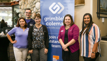 Grimbleby Coleman staff posing for a photo.