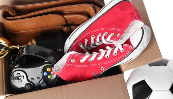 A cardboard box with an assortment of personal belongings