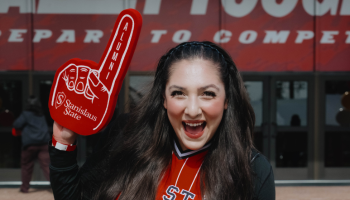 Warrior holding up a foam finger