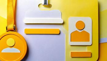 Yellow and white ID badge with a lanyard