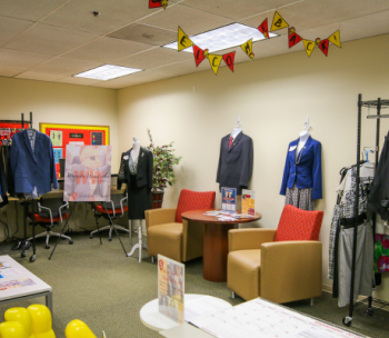 Various racks of formal business attire are on display at the Warrior Wardrobe.