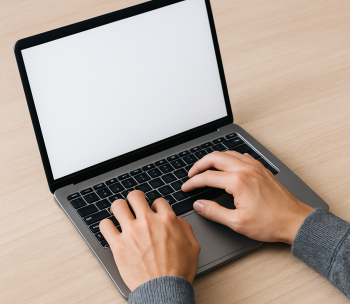 hands typing on a computer