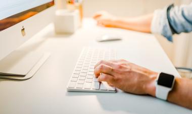 hands at a computer keyboard