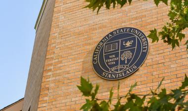 University shield on building