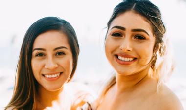 Two women smiling for a picture.
