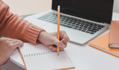 Student taking notes.