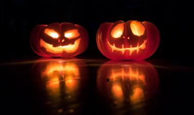 Two lit up pumpkins.